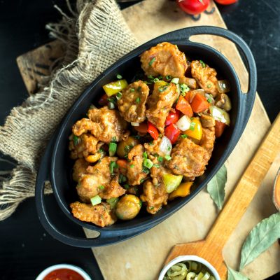 top view fried meat with vegetables in a pan on the board